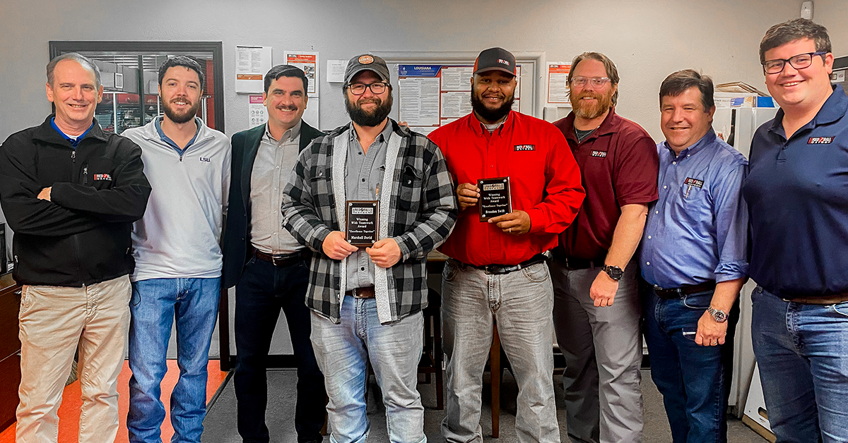 Marshall and Brandon receive Red Ball's Winning with Teamwork Award for work done during the 2021 winter storm.